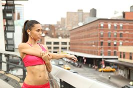 lifestyle model streching along highline preparing to jog